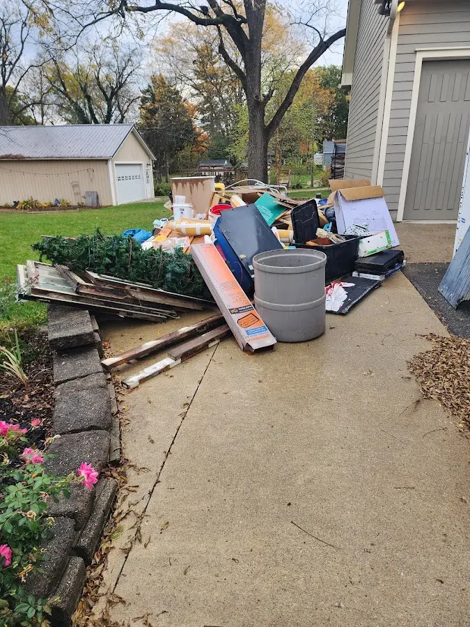 Dumpster being loaded with debris for Roofing Dumpster Rental in Atlantic